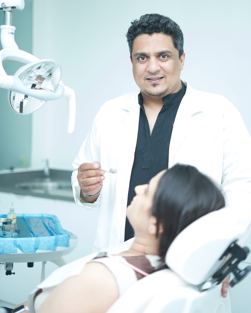 Dr. Sudeep Bhalerao with a patient at 10 Banjara Dental